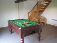 Games lounge with pool and table tennis tables next to the holiday barns. 